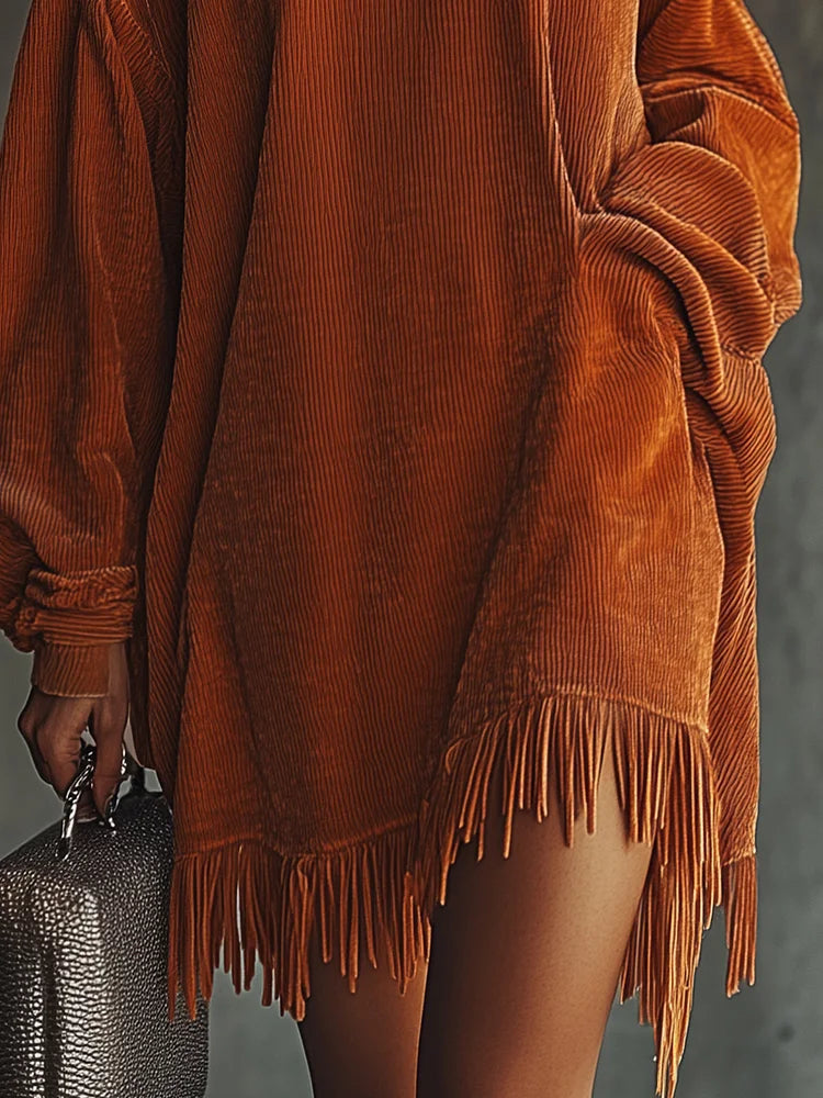 Loose orange corduroy dress with fringed hem and high neck