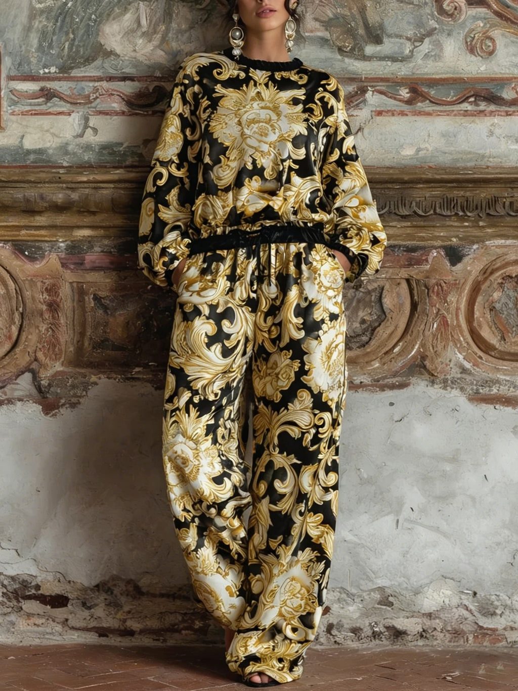 Complete your loungewear collection with this elegant Baroque floral print set, including a long-sleeved top and wide-leg trousers.