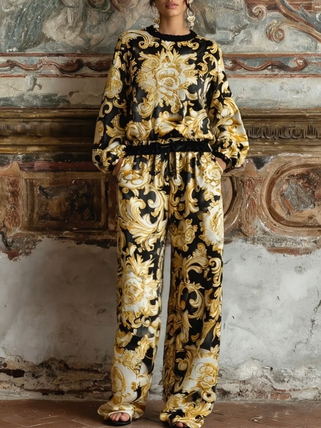 Complete your loungewear collection with this elegant Baroque floral print set, including a long-sleeved top and wide-leg trousers.