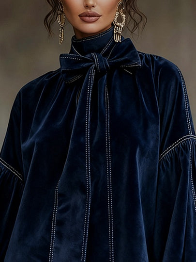 Mini dress in dark blue velvet with bow and lantern sleeves