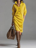 Solid color knit dress with a mandarin collar, long sleeves, and a loose fit